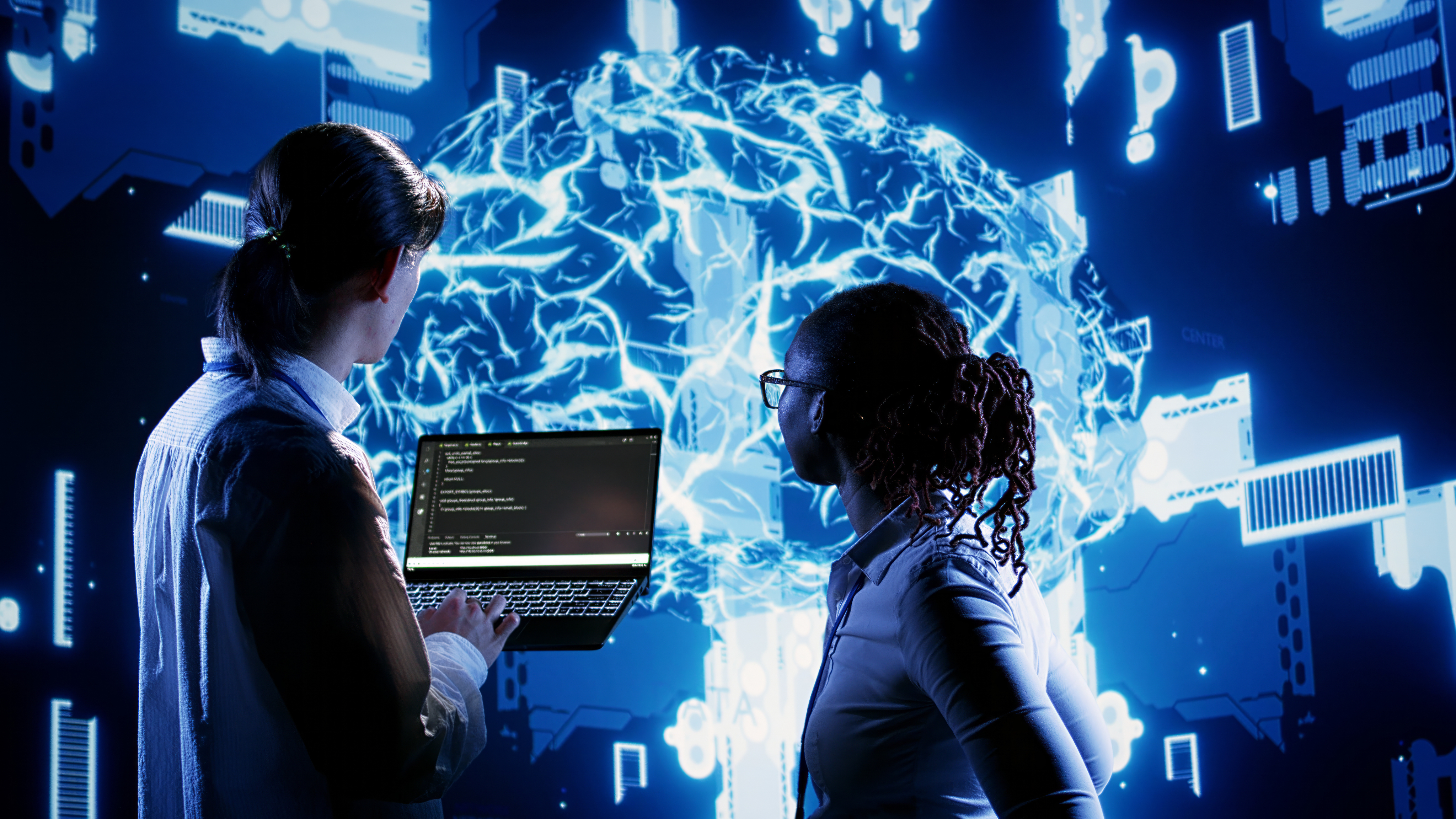 Two engineers reviewing a live cloud infrastructure visualisation
